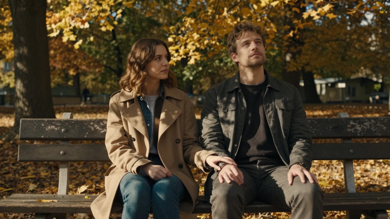 Couple sitting quietly on a park bench, golden light filtering through leaves, no words needed.