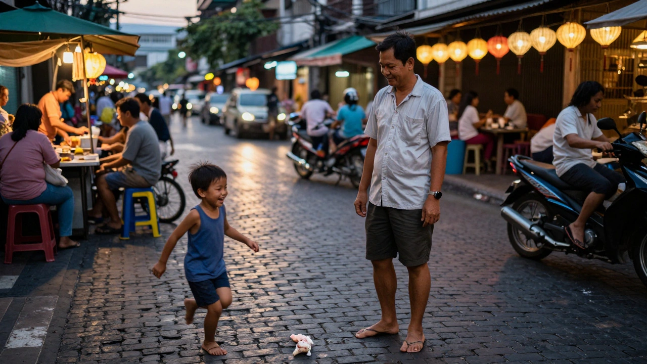 Man smiling softly as a child chases a dropped ice cream on a Bangkok street at dusk.